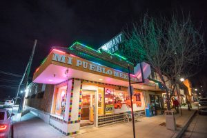 a colorful night shot of Mi Pueblo Mexican restaurant