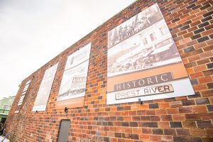 a brick building with historic signs