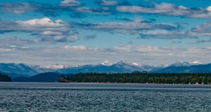Priest Lake with snow capped mountains in the background