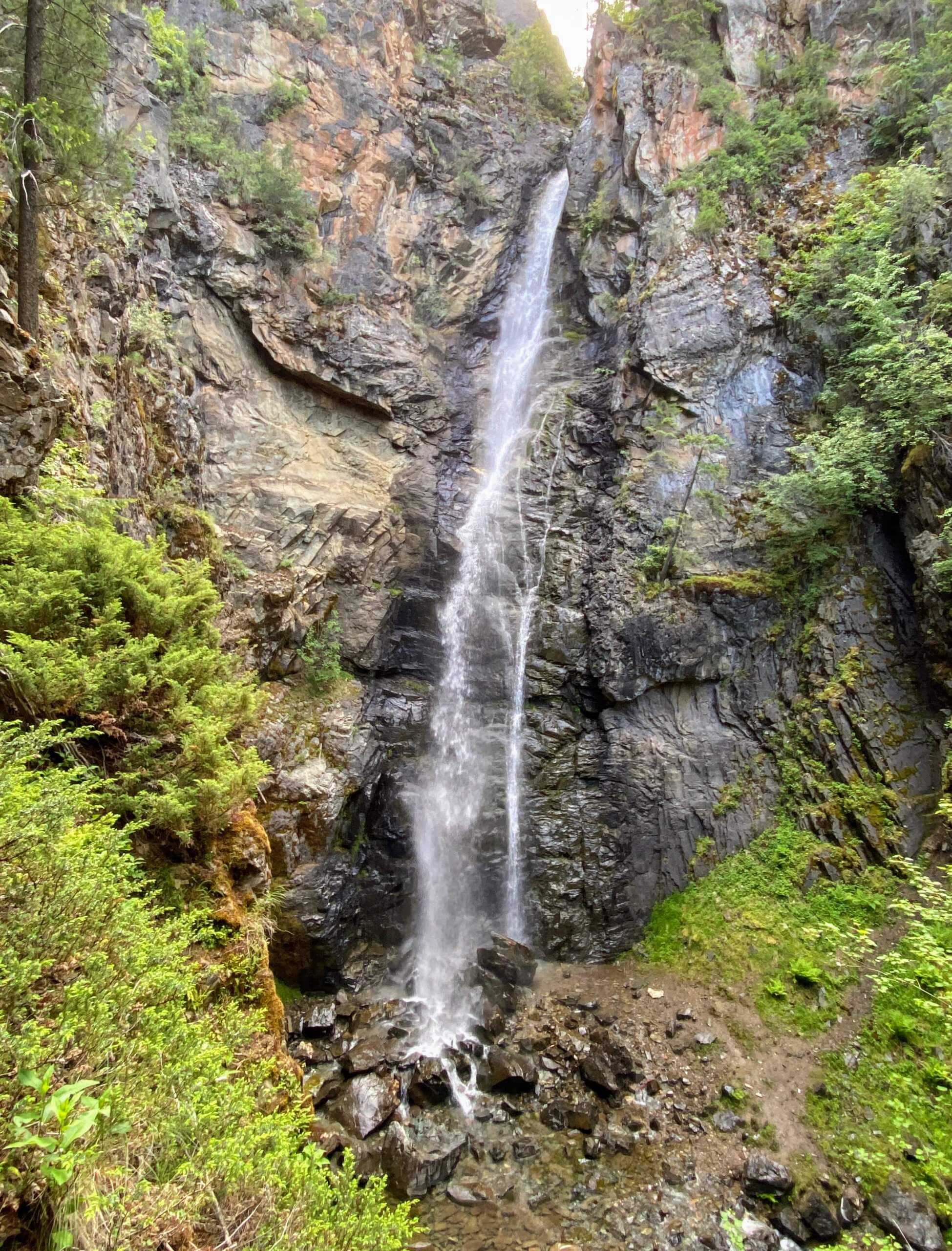 The thin Copper Falls splash 225 feet down rugged heights, green trees lining the rock near Bonners Ferry in the Kootenai National Forest.