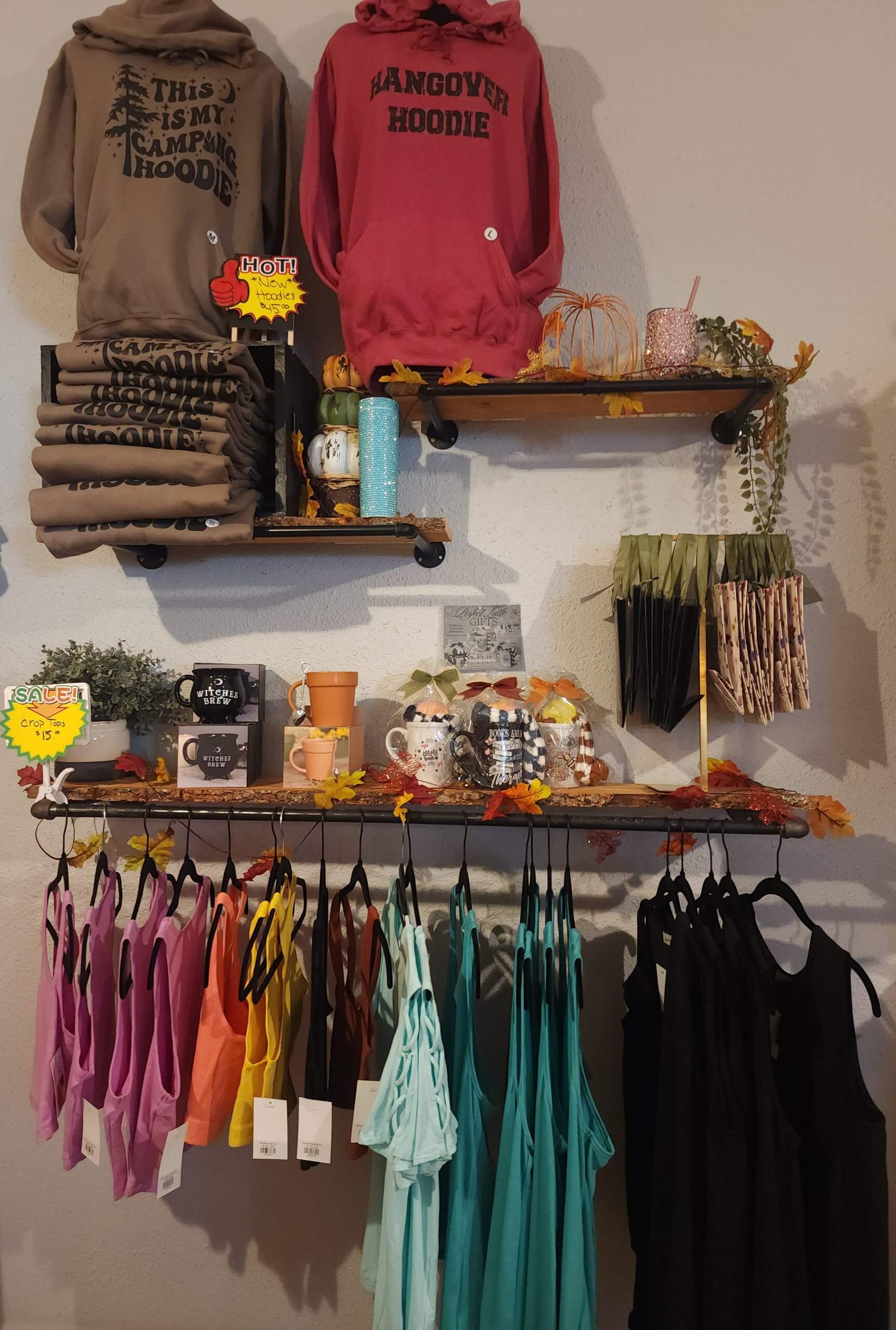 Several pieces of clothing, bags and cups on display at the Mountain Top Boutique.