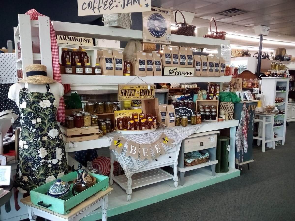 Shelves of coffee, jam and honey on display inside Happy's Marketplace.